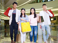 two young asian couples people shopping in a modern mall