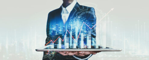 Business finance technology concept, Professional business man using tablet on network city and digital marketing chart graphic at night in Bangkok, Thailand